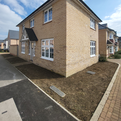 Grass removal and addition of gravel around house in Ely.